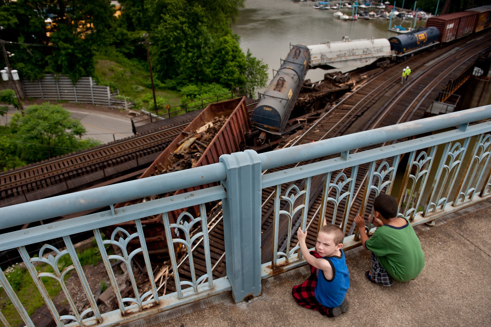 Photo of kids looking at derailed trains