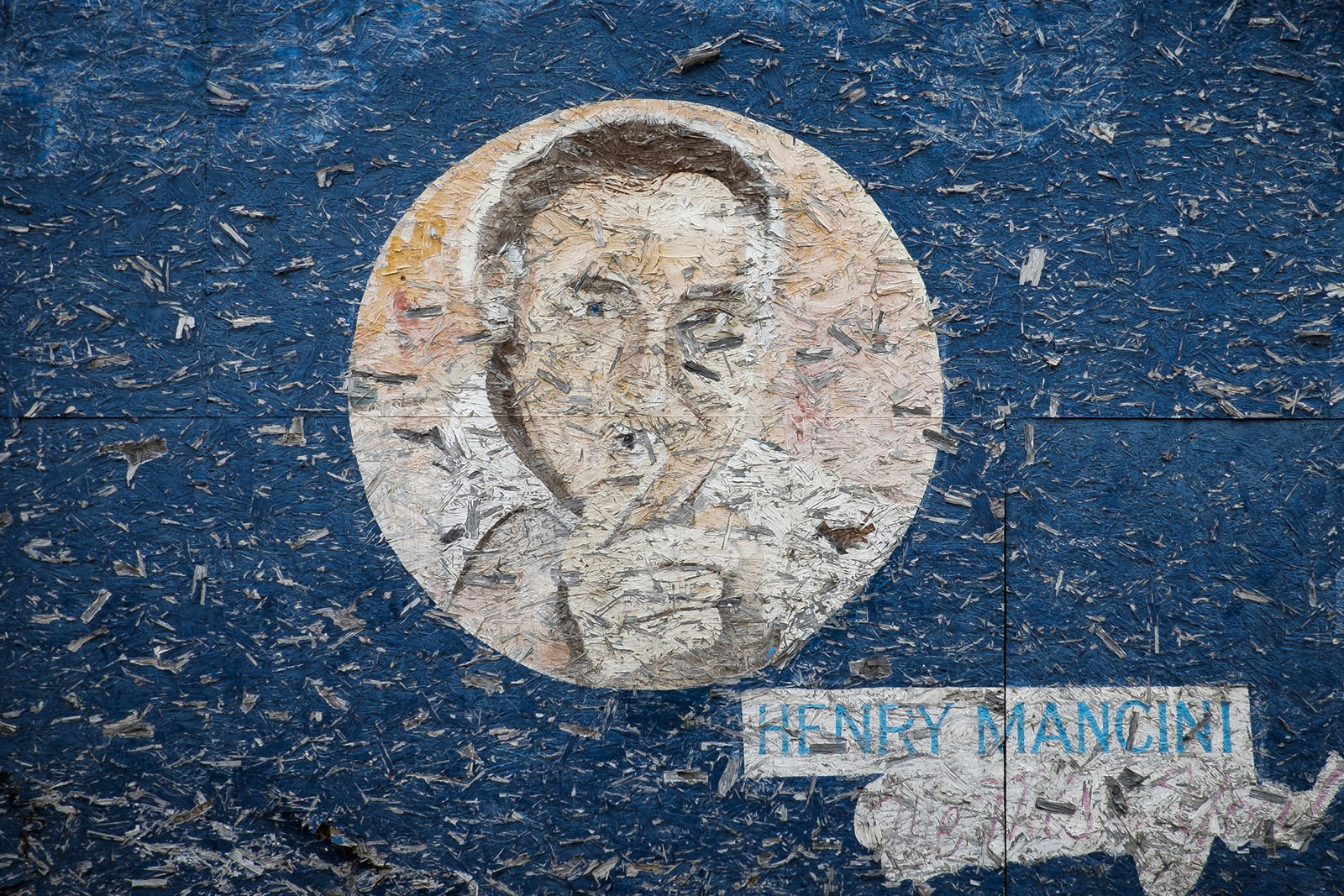 A faded mural: a tribute to composer Henry Mancini.