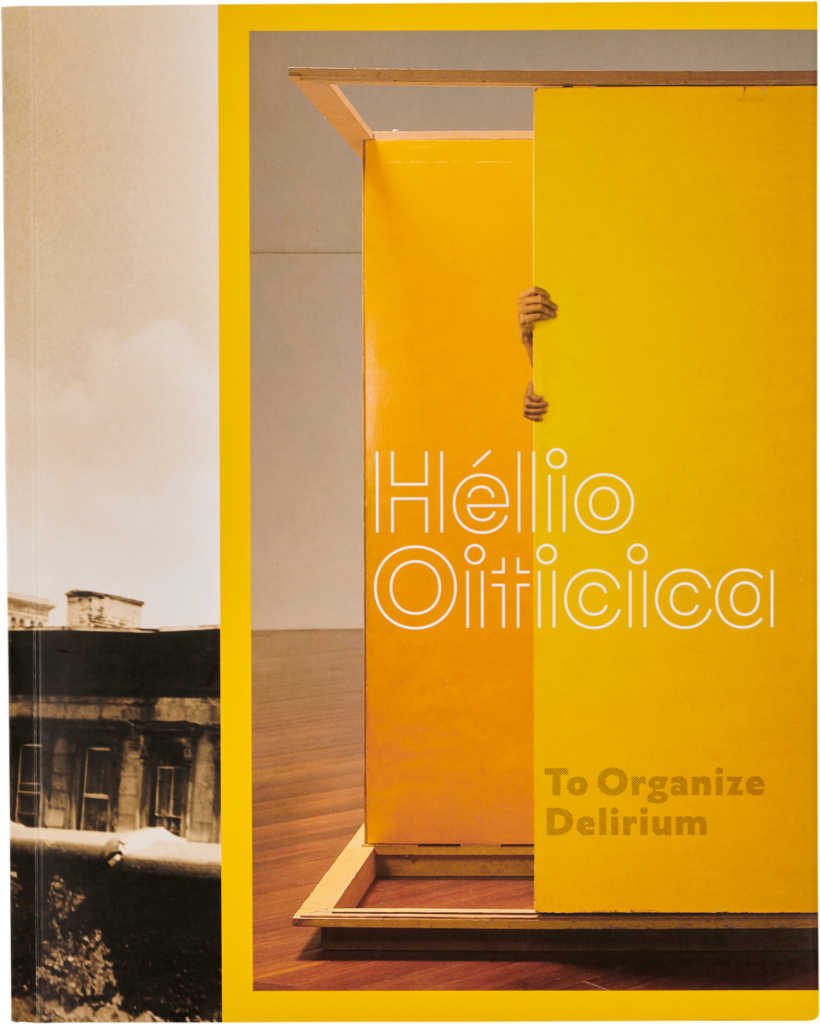 Yellow book cover titled Helio Oiticica, To Organize Delirium