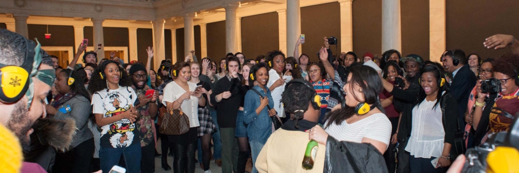 Crowd dancing in large marble hall