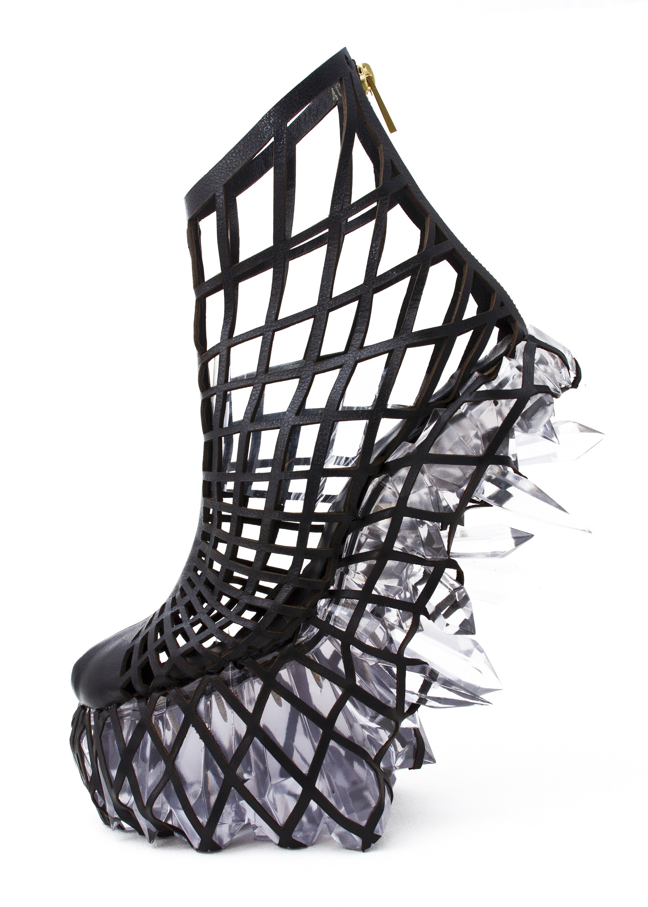 High-heel shoe made of a woven black material with a zipper at back. In place of a sole, it has jagged crystals on the base, and sticking out from the heel.