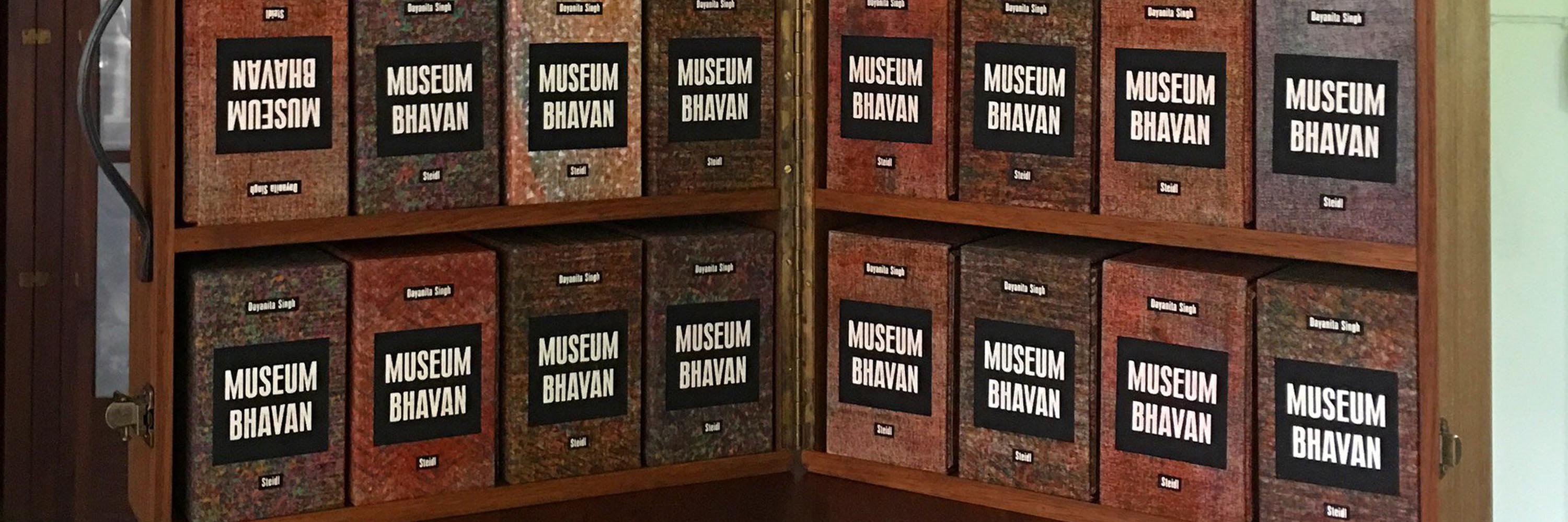 Wooden case containing several bound volumes labeled "Museum Bhavan"