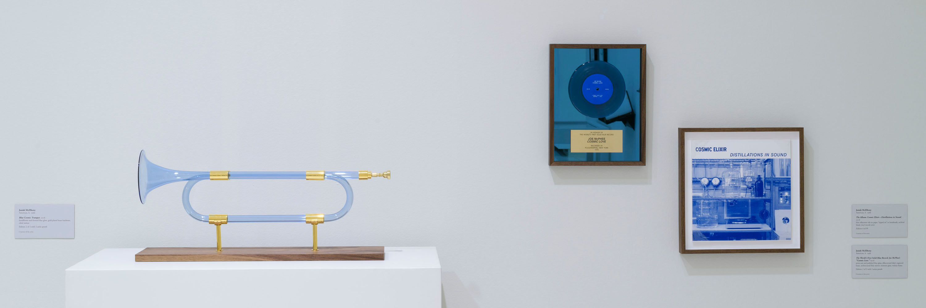 Blue glass horn, with blue record on the wall and a blue record album cover