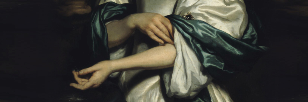 A close up of a woman's arms, one holding her sleeve and the other held delicately facing up.