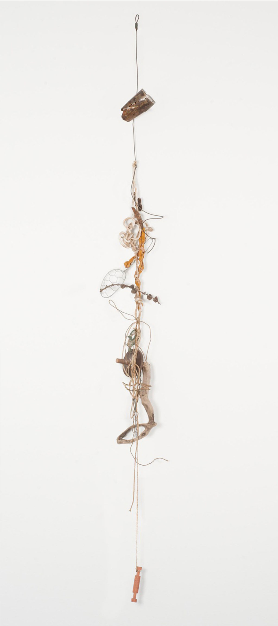 A delicate sculpture reminiscent of a wind chime, made with one long thread wrapped around small twisted objects