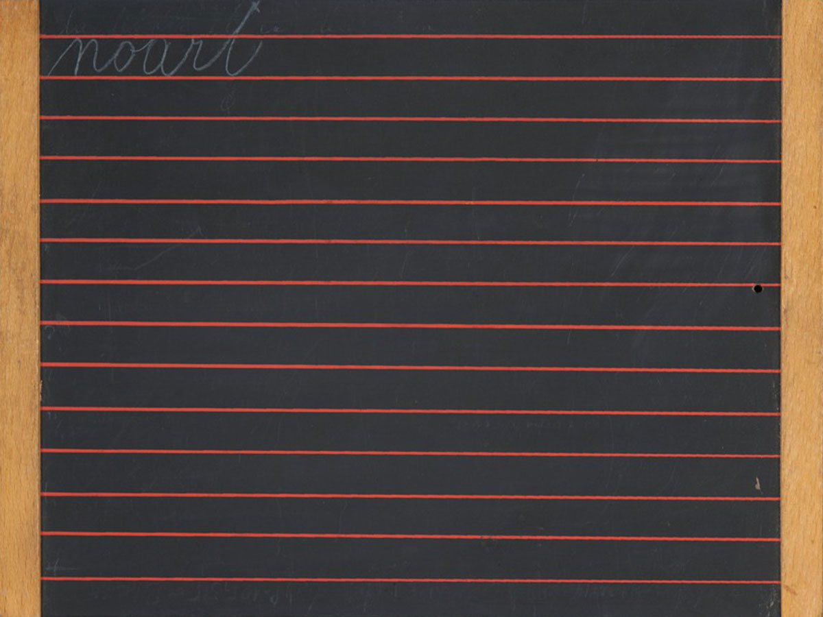 A school chalkboard with red lines; "noart" is written in cursive at the top of the chalkboard