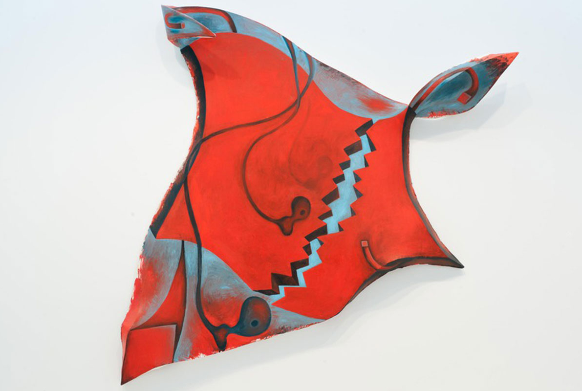 An abstract canvas shaped like a torso, painted with shades of red and light blue with swooping black shapes across