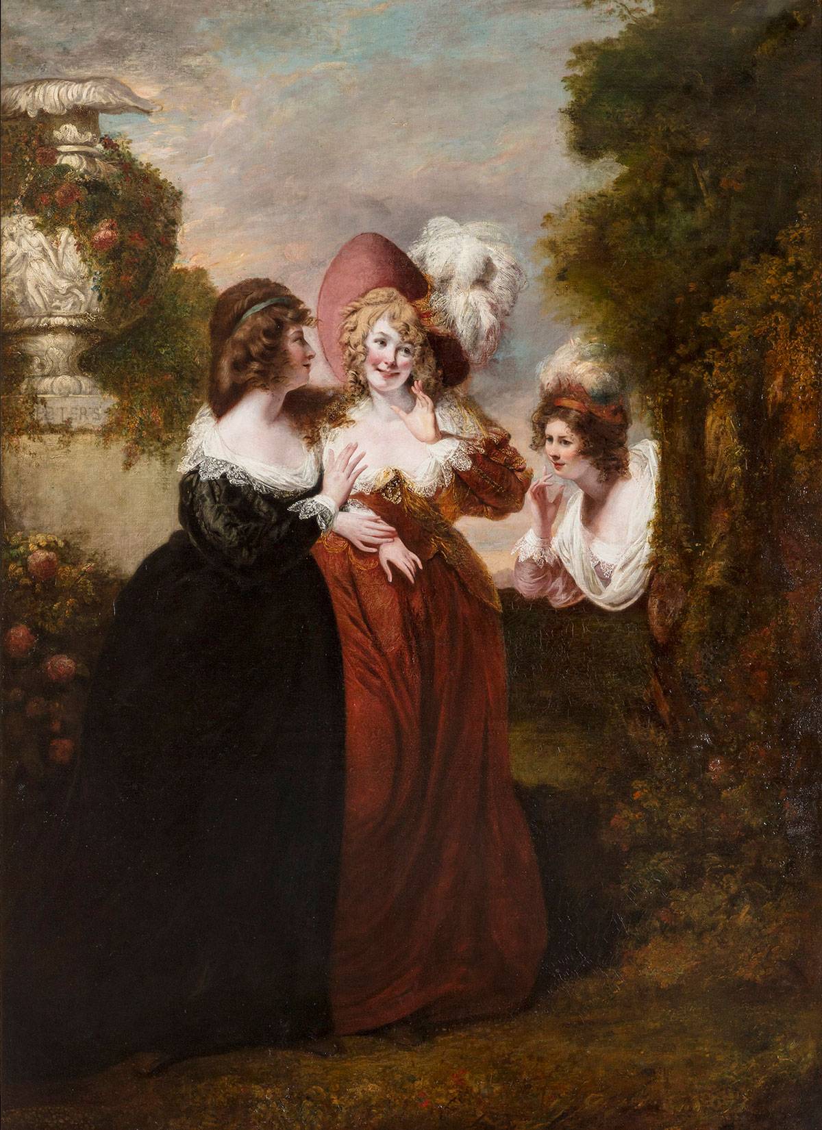 Three women in long, richly colored gowns stand in a garden; two women lean close together and smile, and the third leans in from the corner of the frame, spying on them