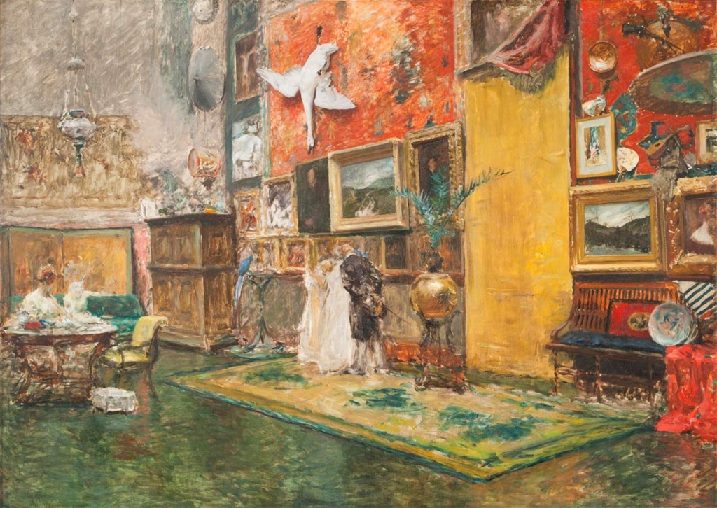 Painting of artist studio interior furnished with a salon of paintings and other objects with two figures looking over work in progress and the artist seated at a nearby table.