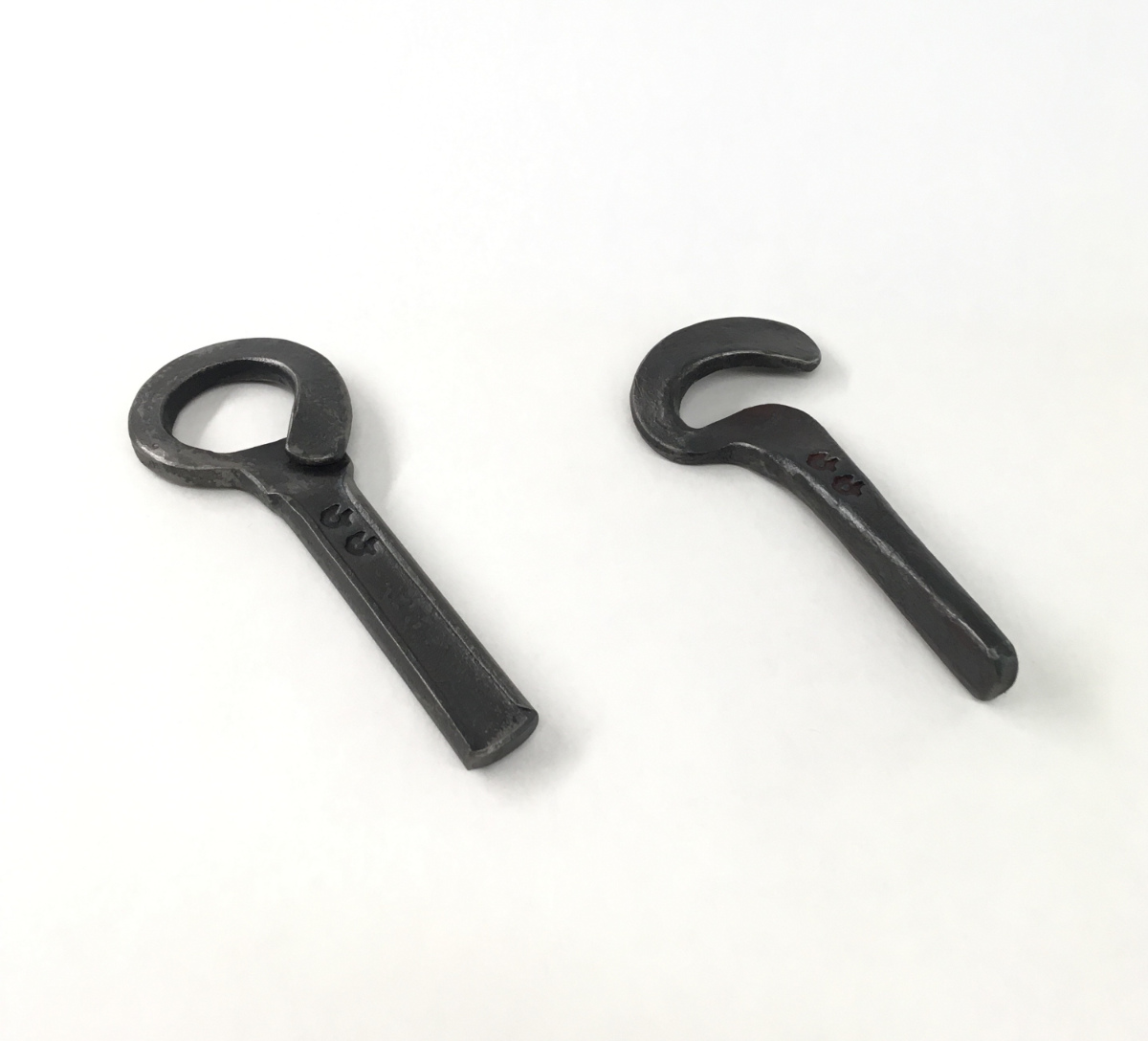 Product image of two pieces of minimalist ironwork