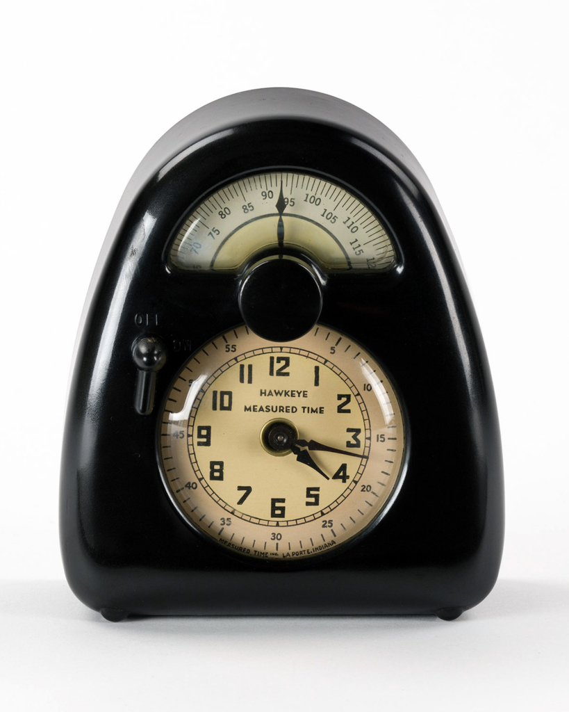 A mid-century style clock and kitchen timer.