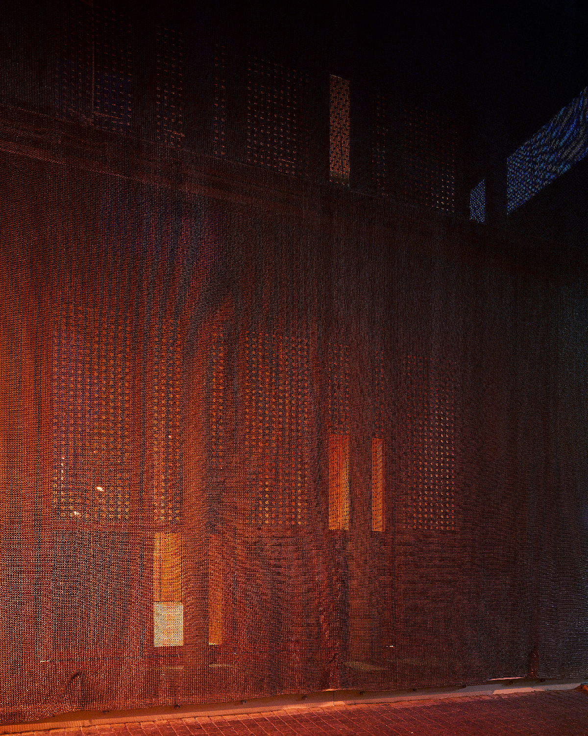 Abstract photograph of a mesh metal wall.