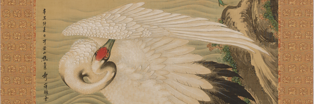 A detail of a print of a crane and pine tree
