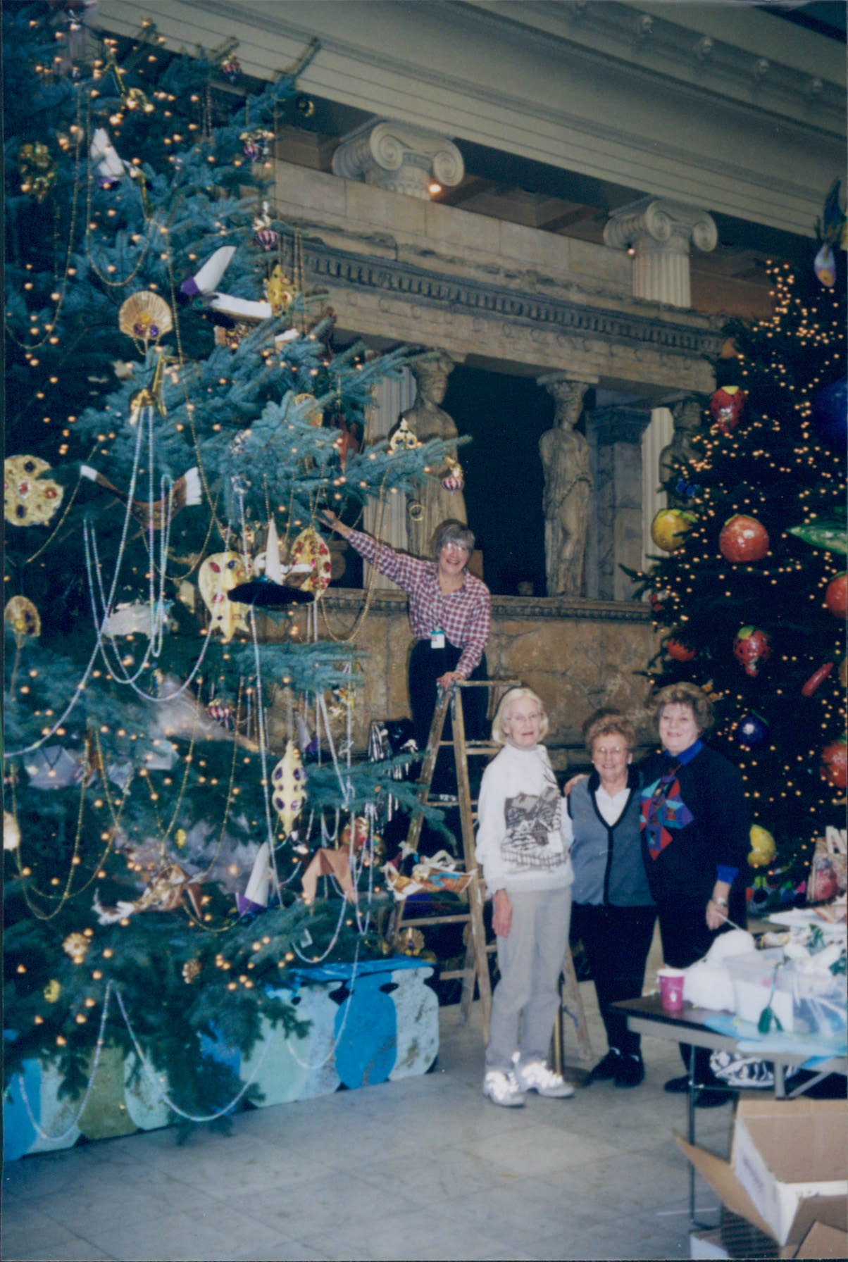 A group of women decorate trees c. 1980