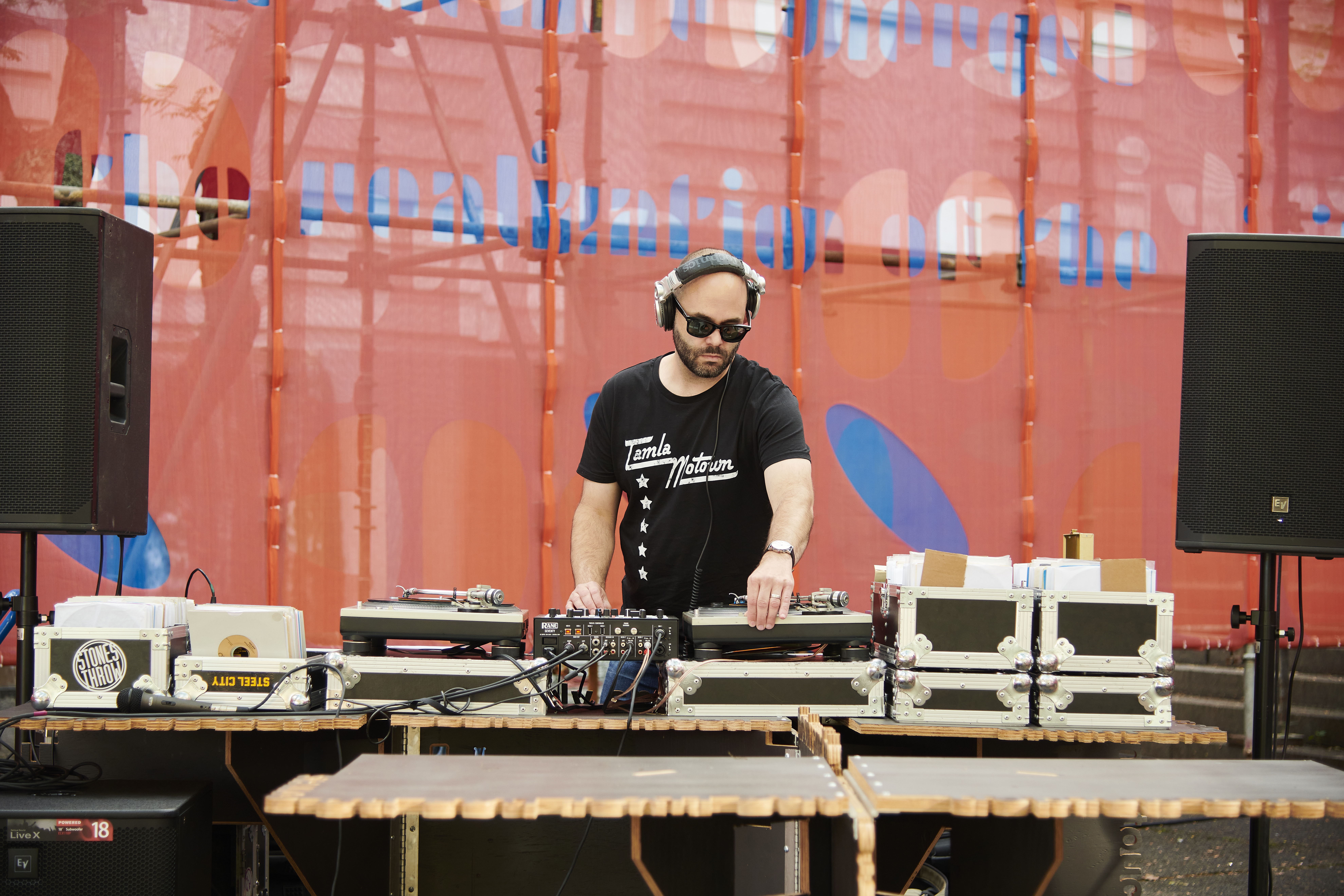 A Dj performing Outdoors