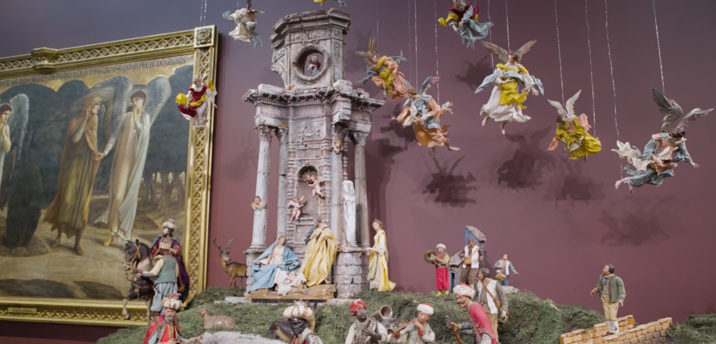 Photo of the neopolitan presepio featuring a portion of a structure with angels hanging from the sky