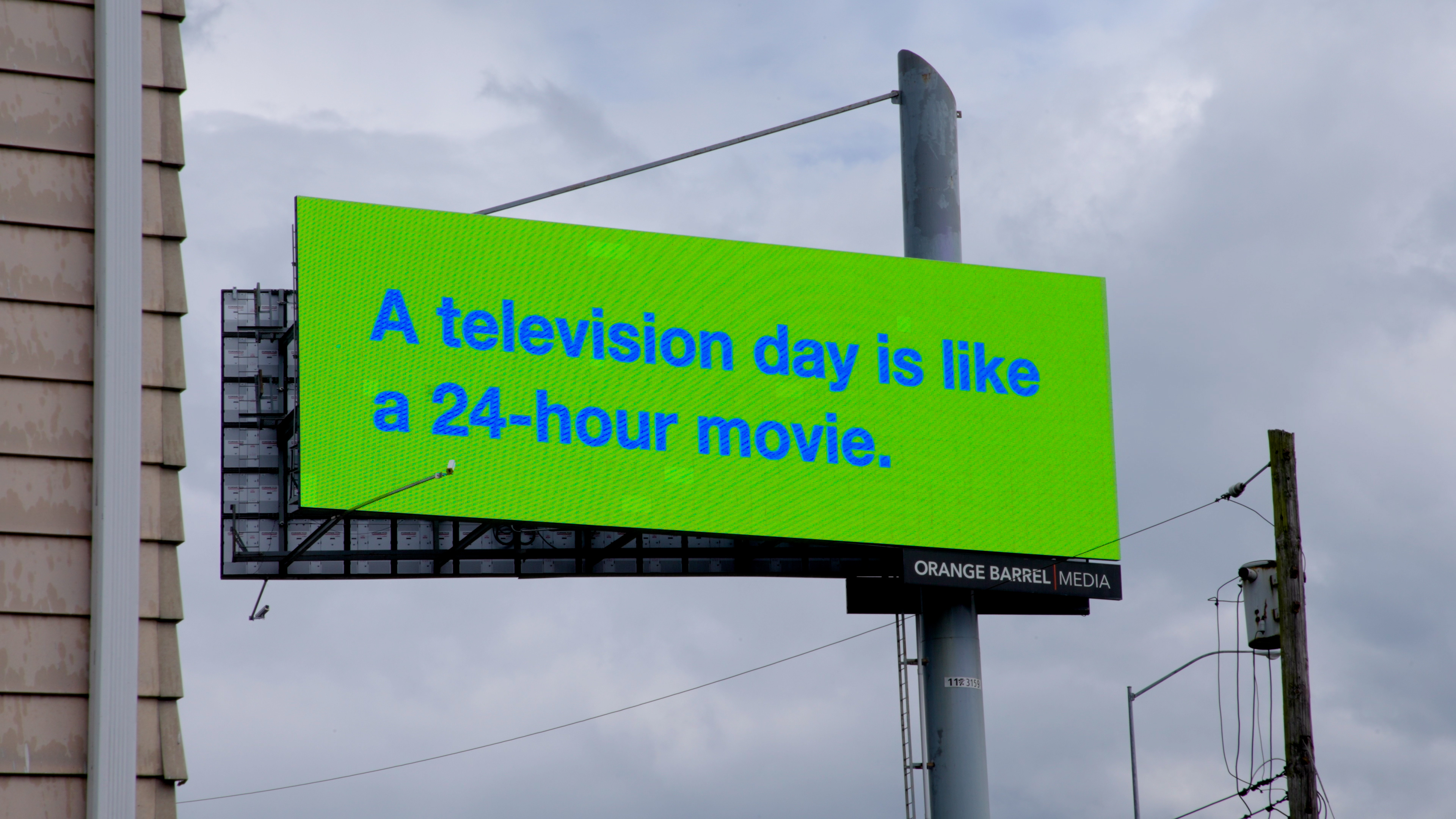 a billboard that says: A television day is like a 24-hour movie
