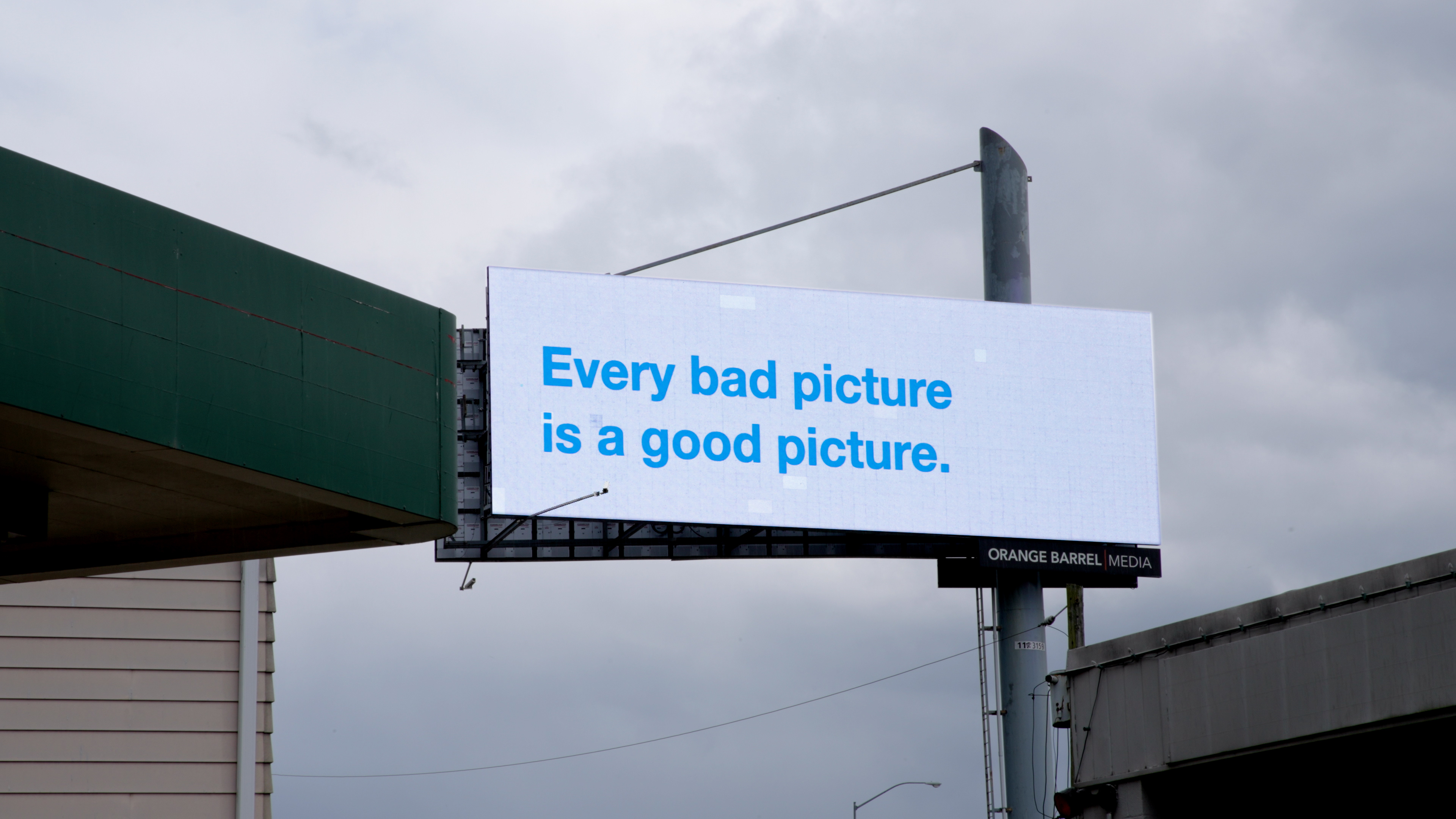 a billboard that says: Every bad picture is a good picture