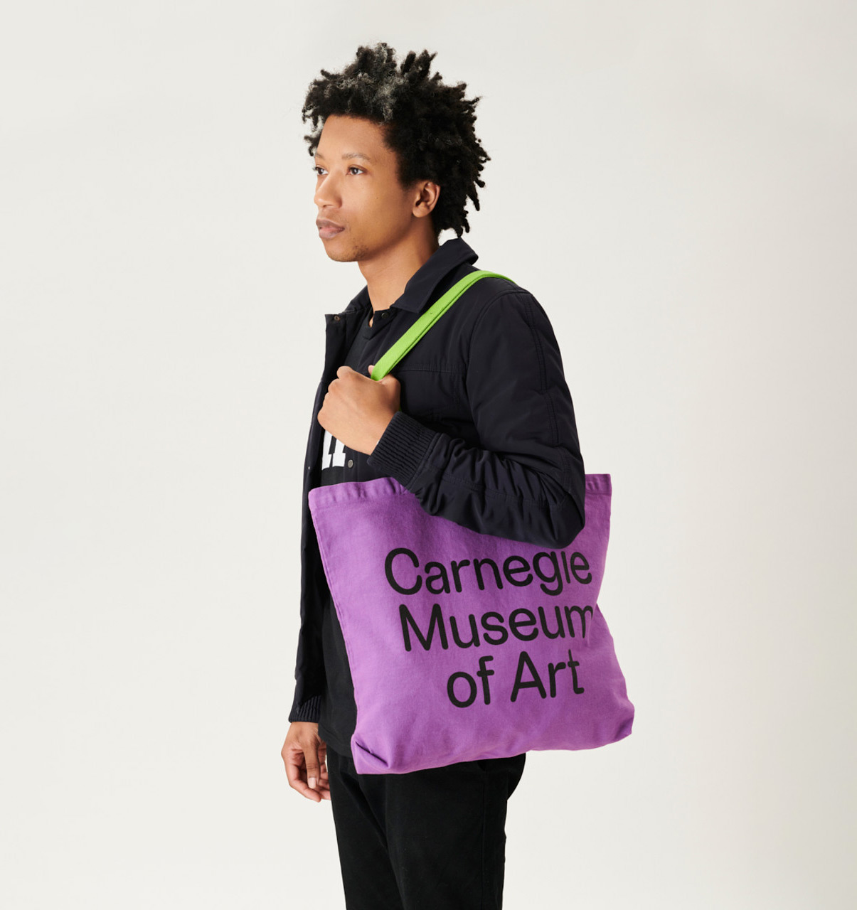 a person holding a purple tote bag