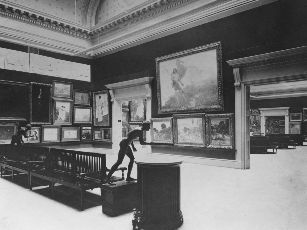View of the first Carnegie International in 1897 showing various paintings