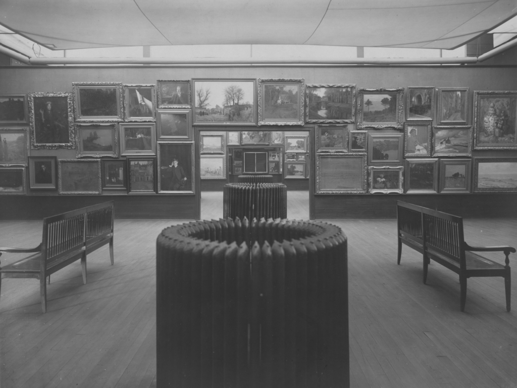 View of the first Carnegie International in 1905 showing various paintings