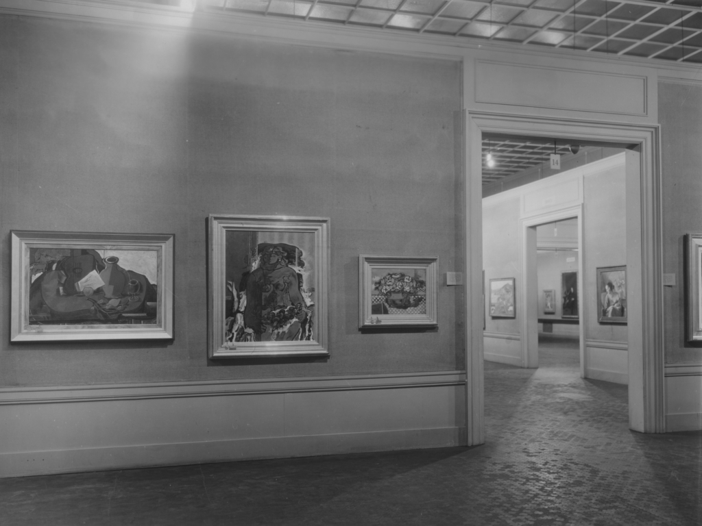 View of the first Carnegie International in 1928 showing various paintings