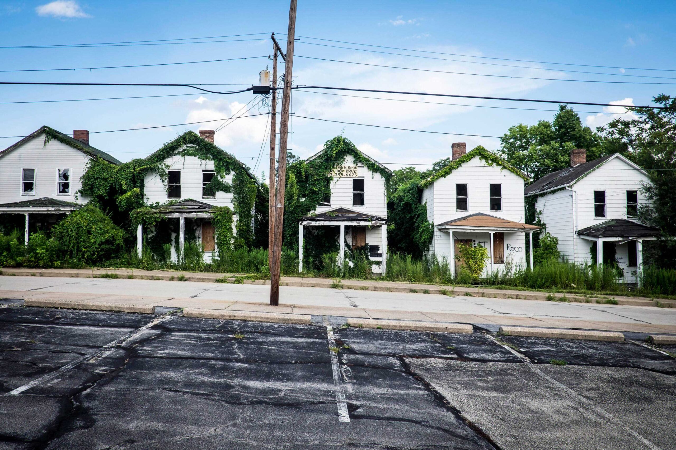 A photograph of abandoned and dilapidated row houses in Monessen, Pennsylvania.