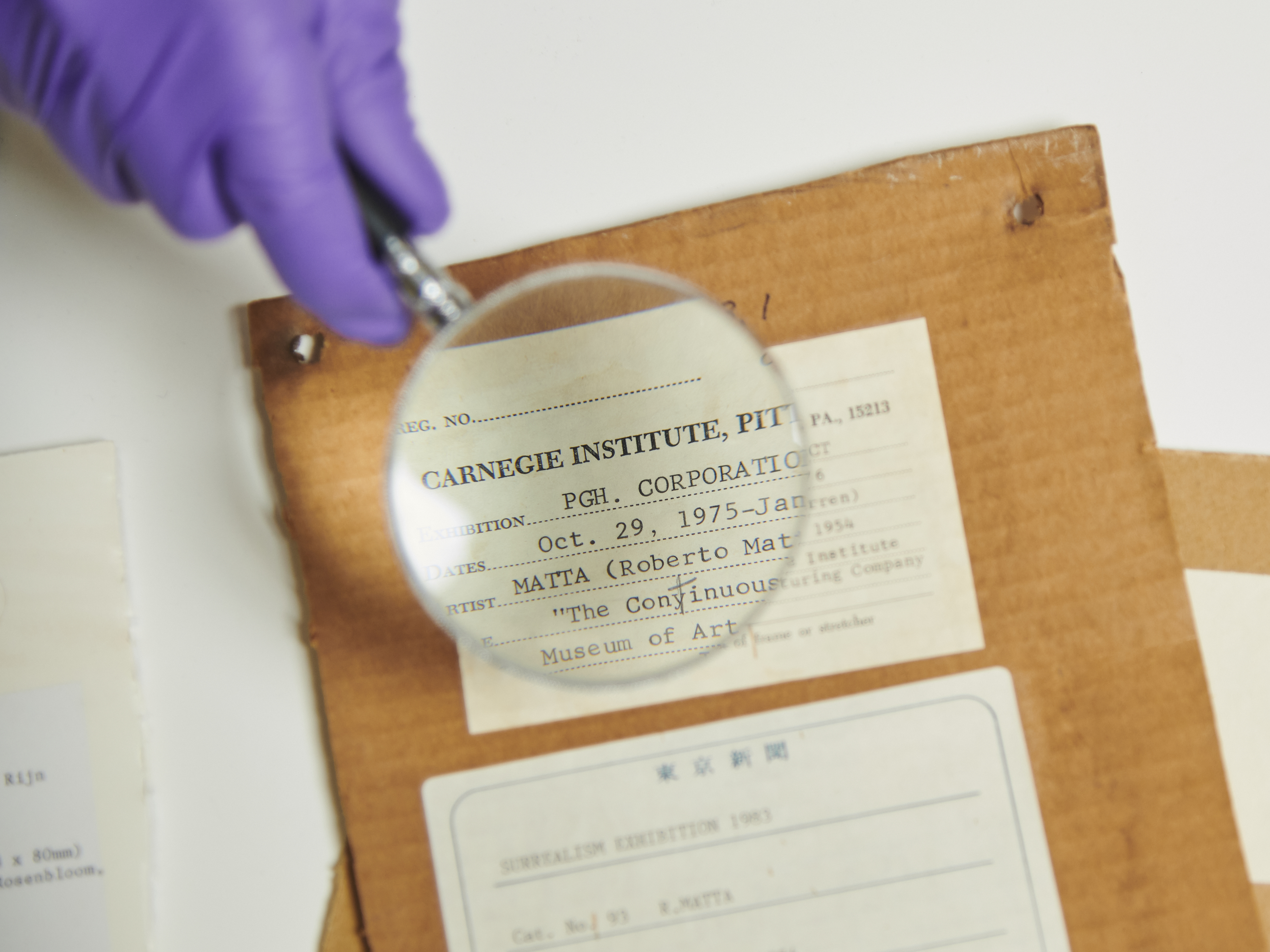 A magnifying glass over an envelope.