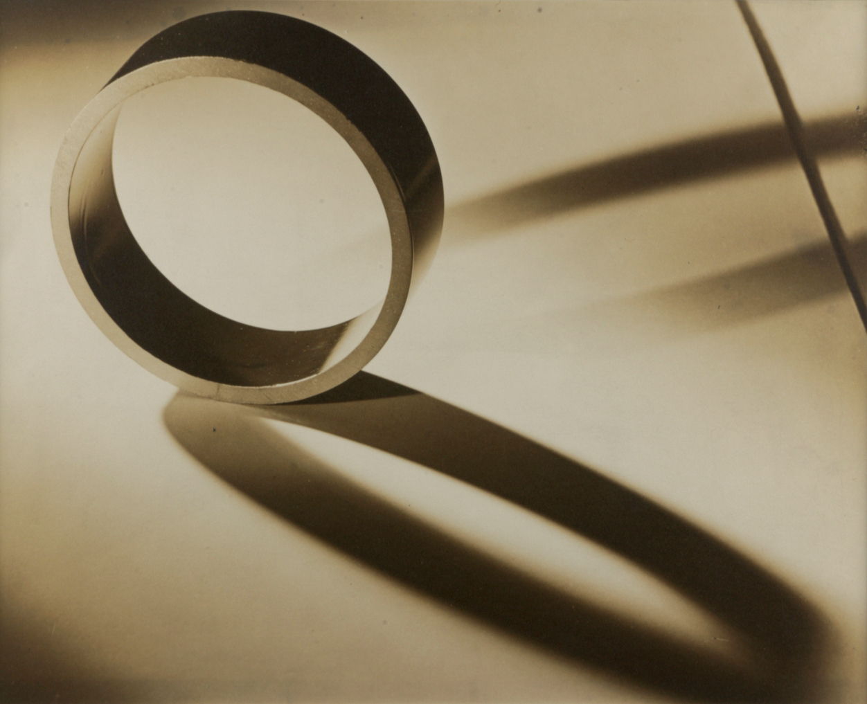 Metal ring and shadows by Luke Swank