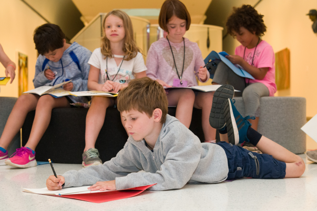 children drawing at a summer camp event