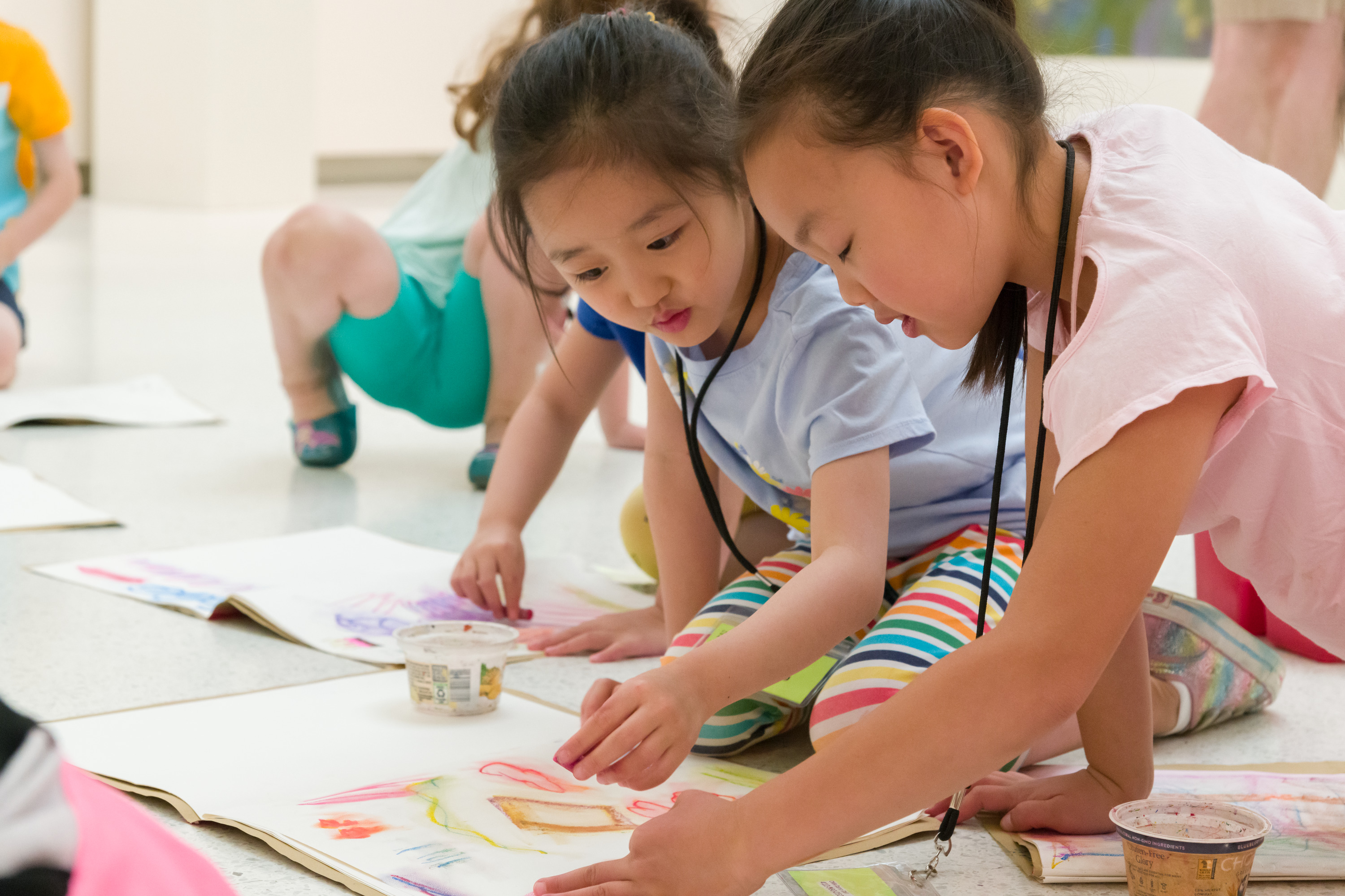 children painting at a summer camp event
