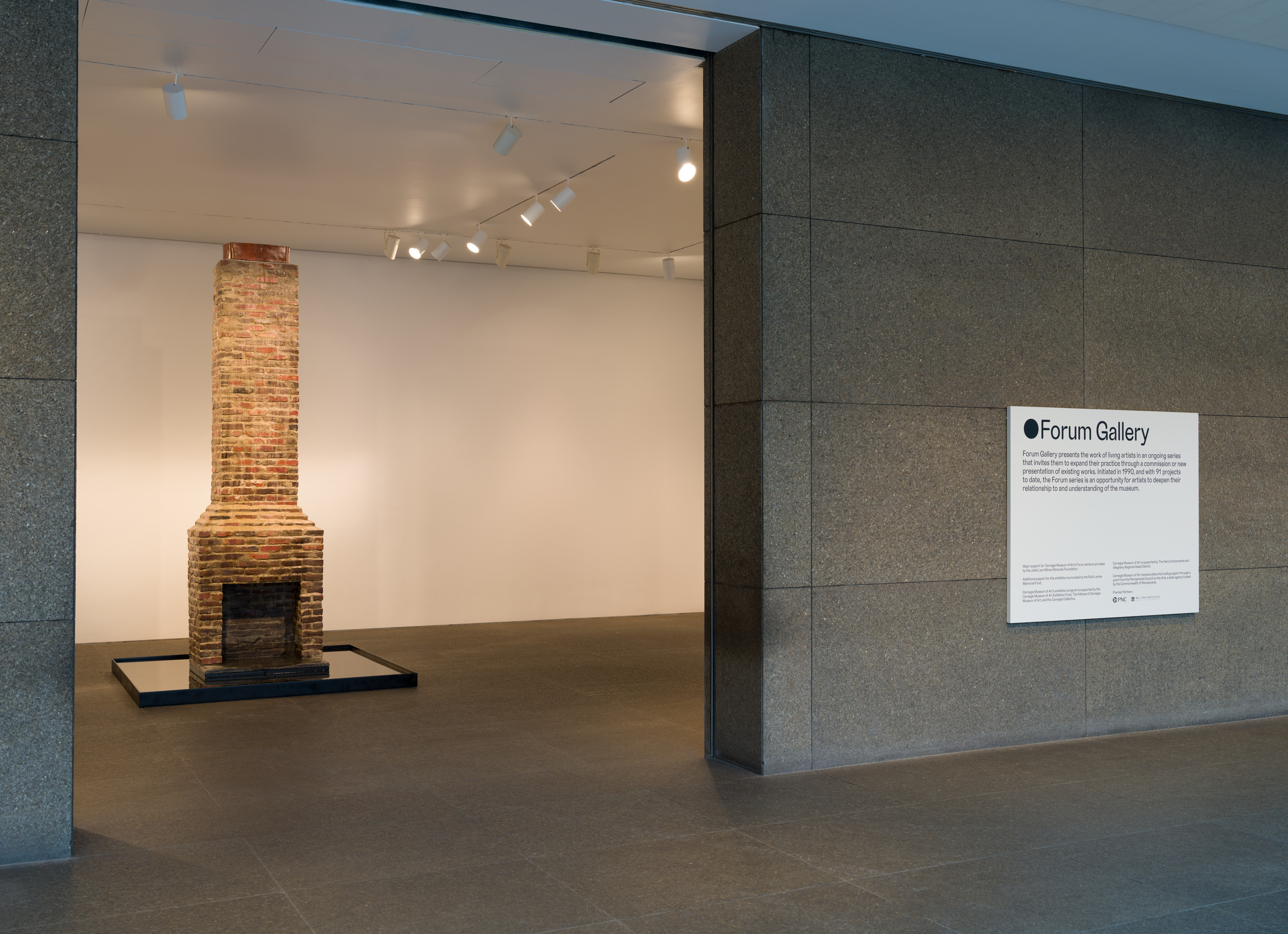 installation view of a chimney place in the center of forum gallery