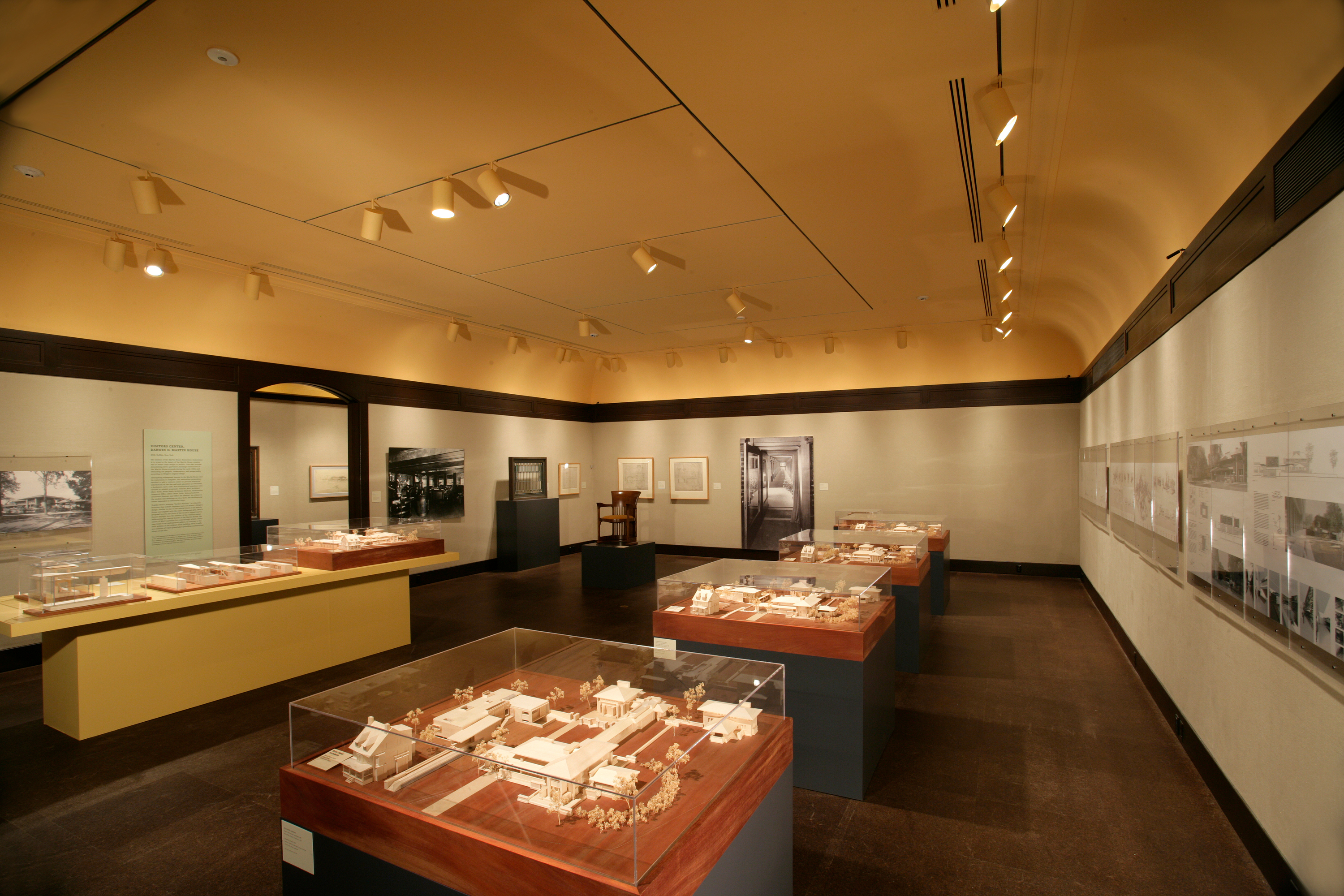 inside of Frank Lloyd Wright exhibition in heinz gallery featuring many miniature dioramas