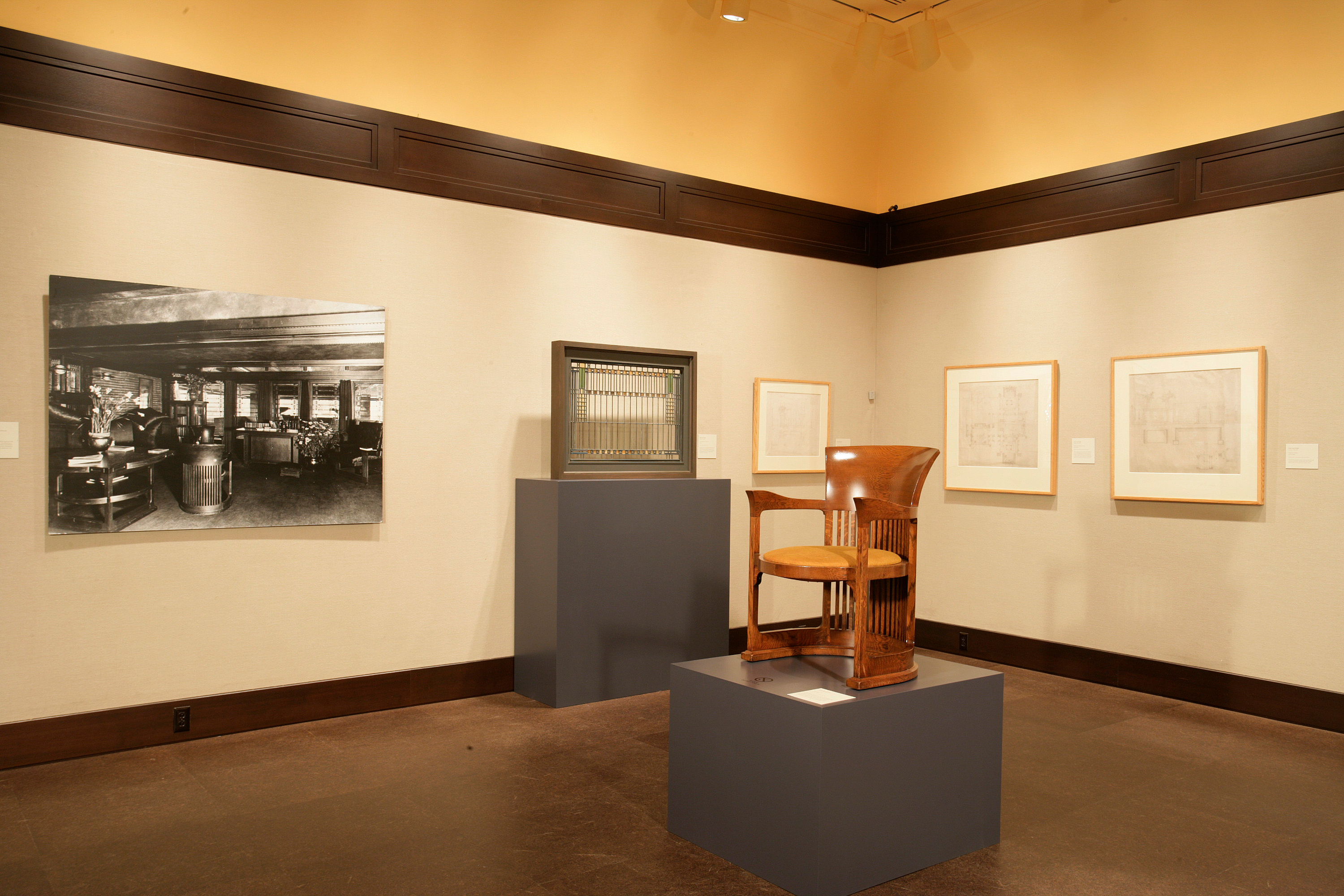 inside of Frank Lloyd Wright exhibition in heinz gallery featuring many miniature dioramas