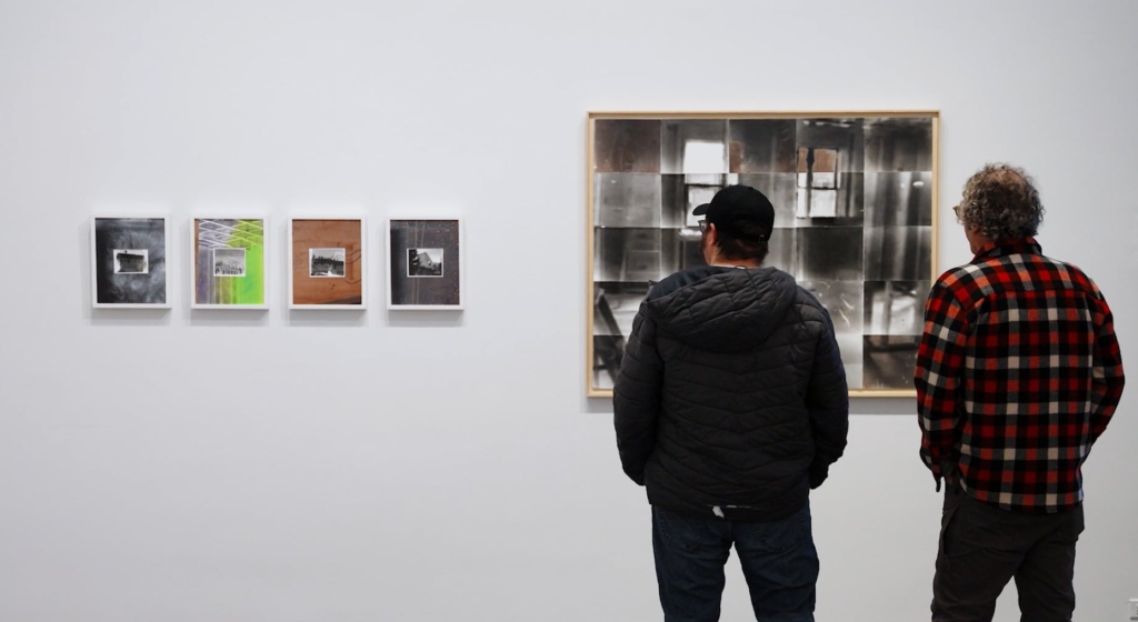 museum goers looking at artworks on the wall