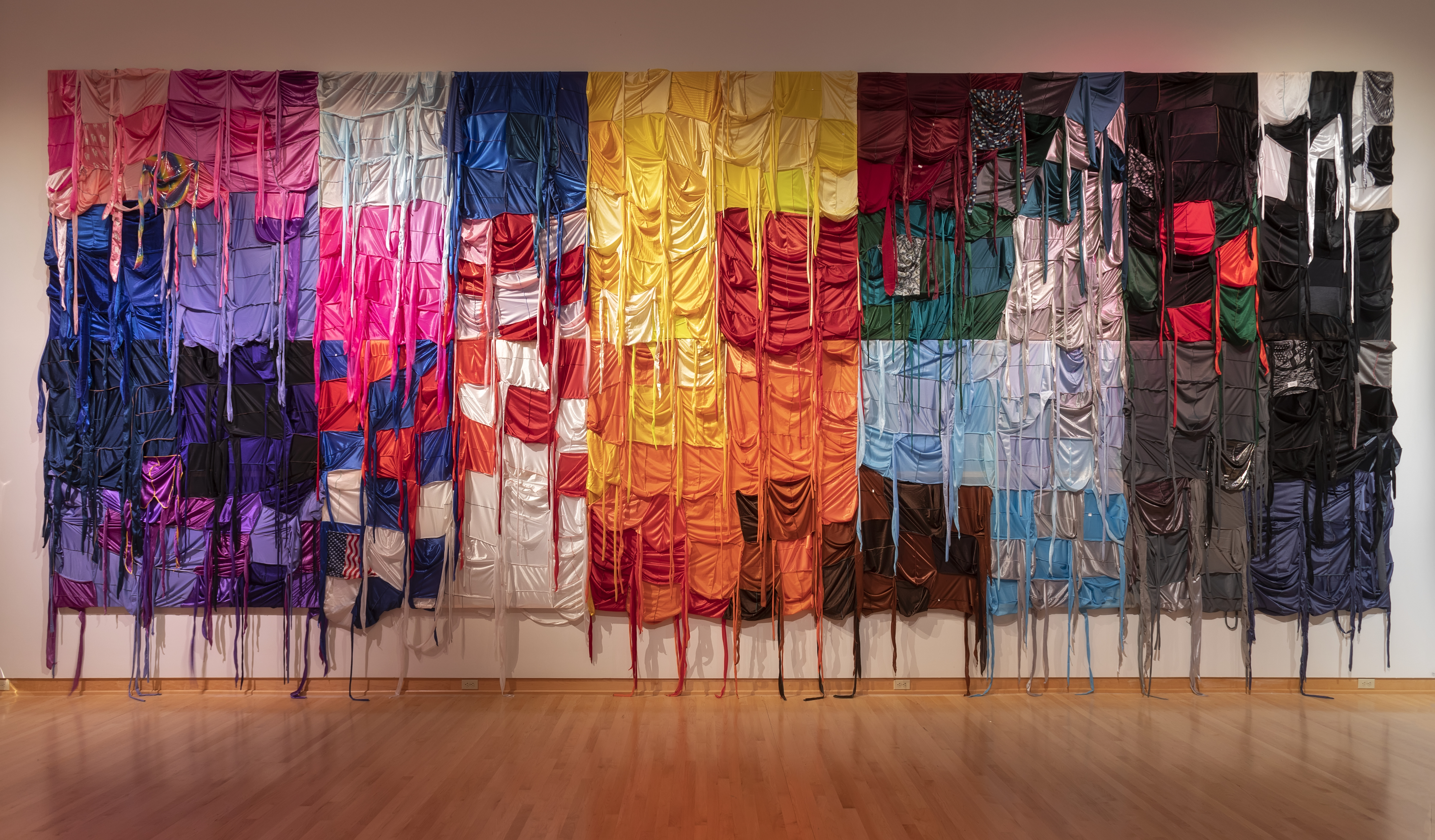 collage of fabric curtains hanging from a massive canvas