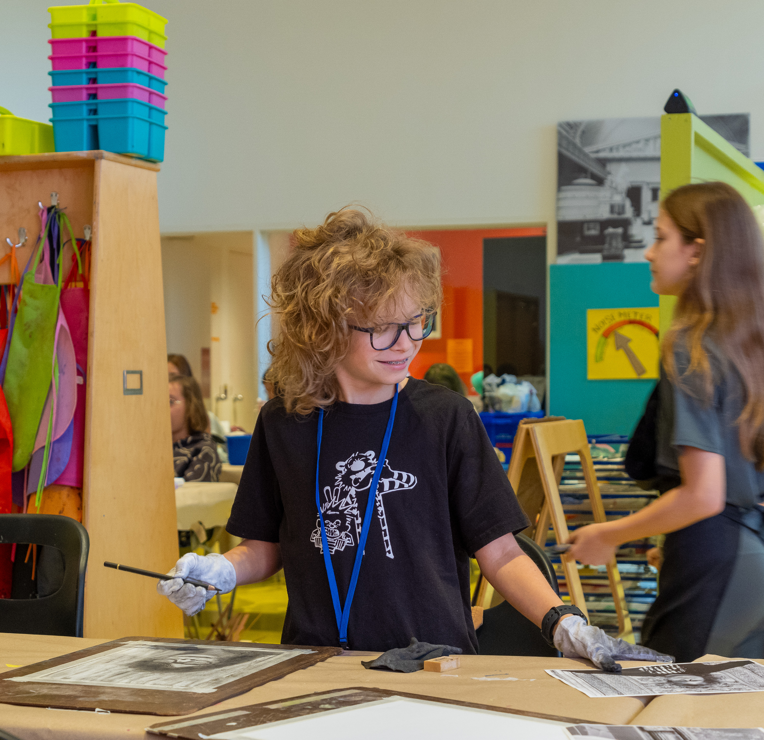 kids making art with charcoal