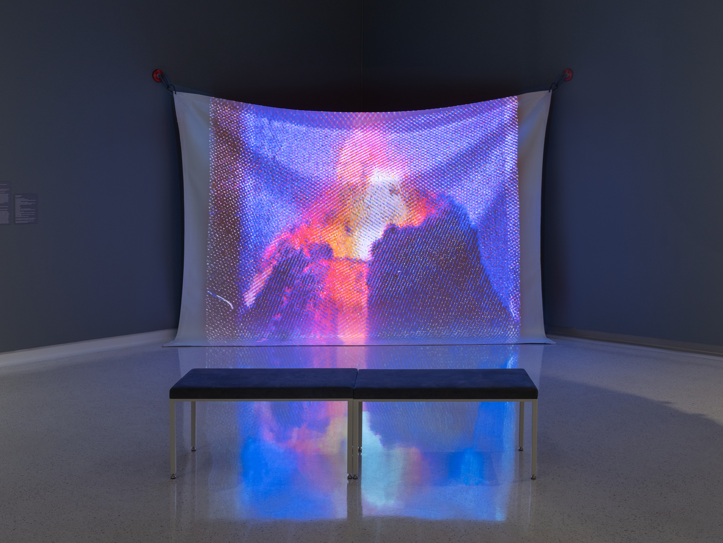 photo of a screen playing a shot from My Cauldera by Cauleen Smith