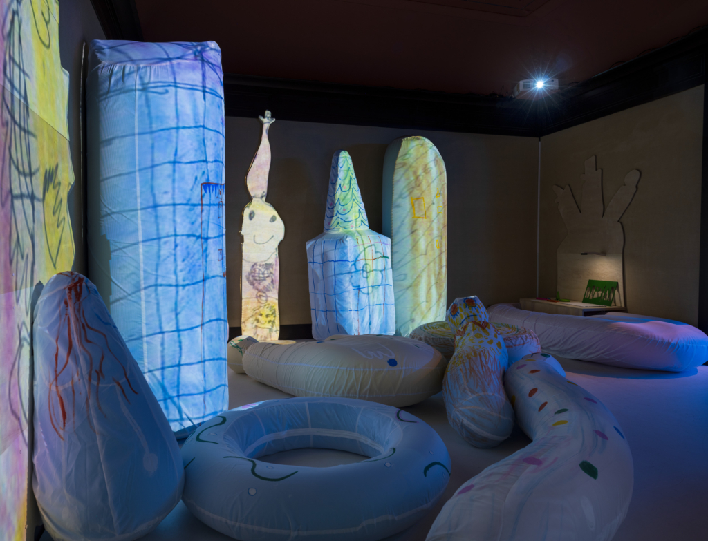 various filled pillows apart of an art exhibit