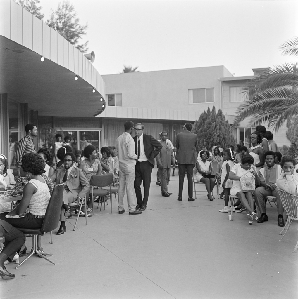 people outside Cosmetiques campaign rally at Moulin Rouge