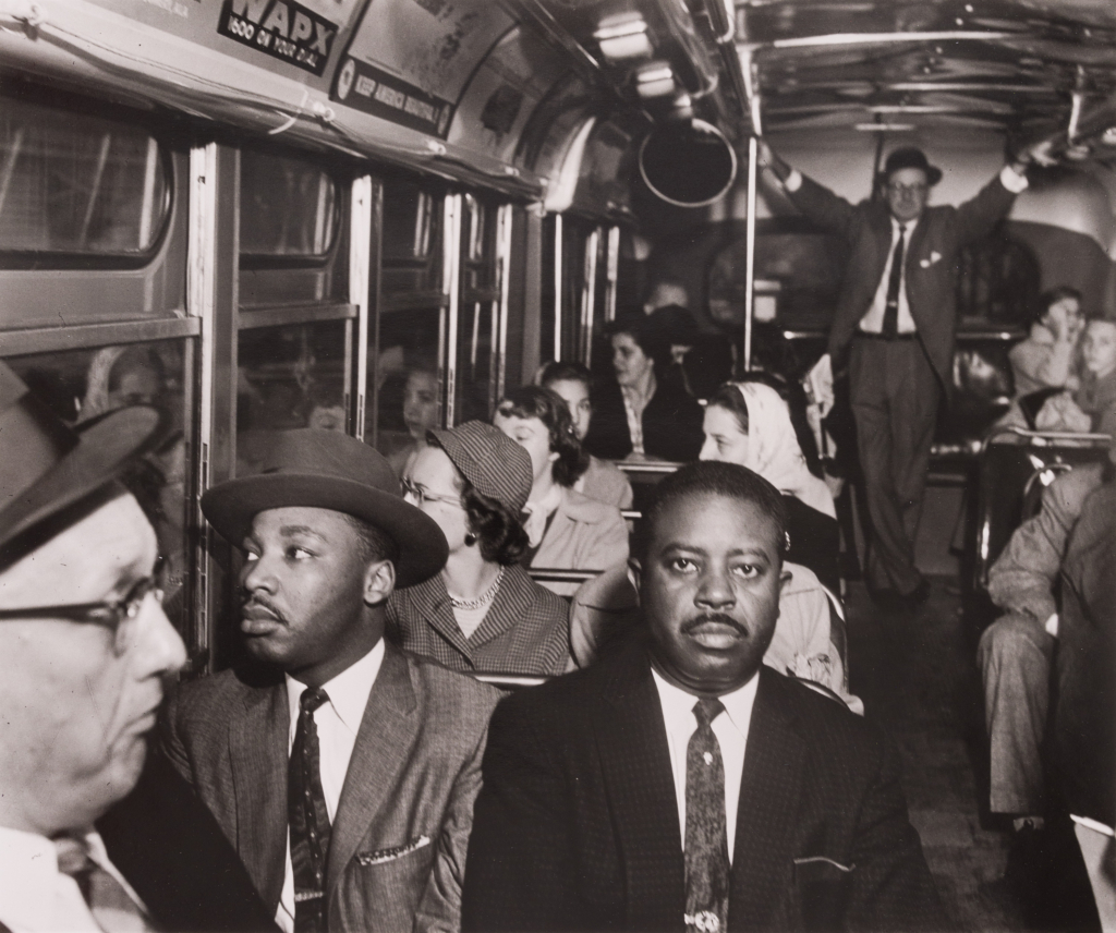 photo of various people riding an bus