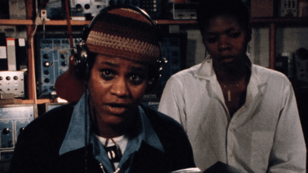 two people in an audio visual room