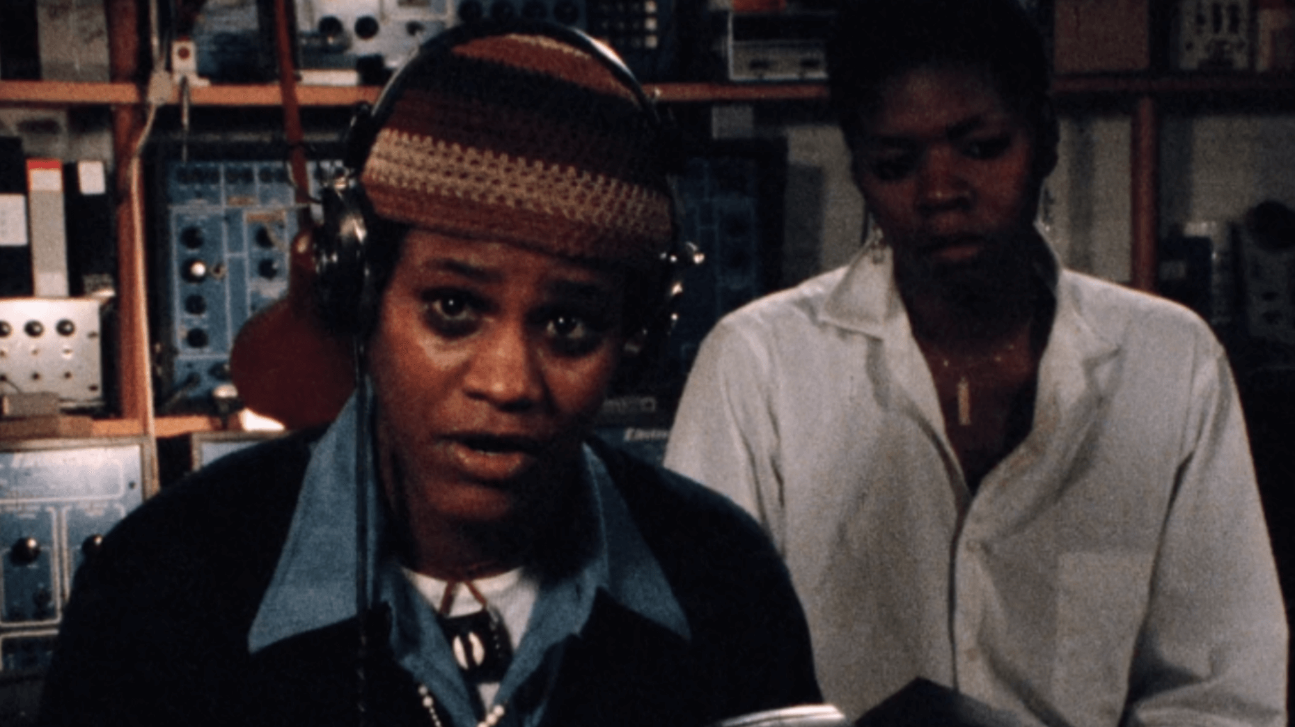 two people in an audio visual room