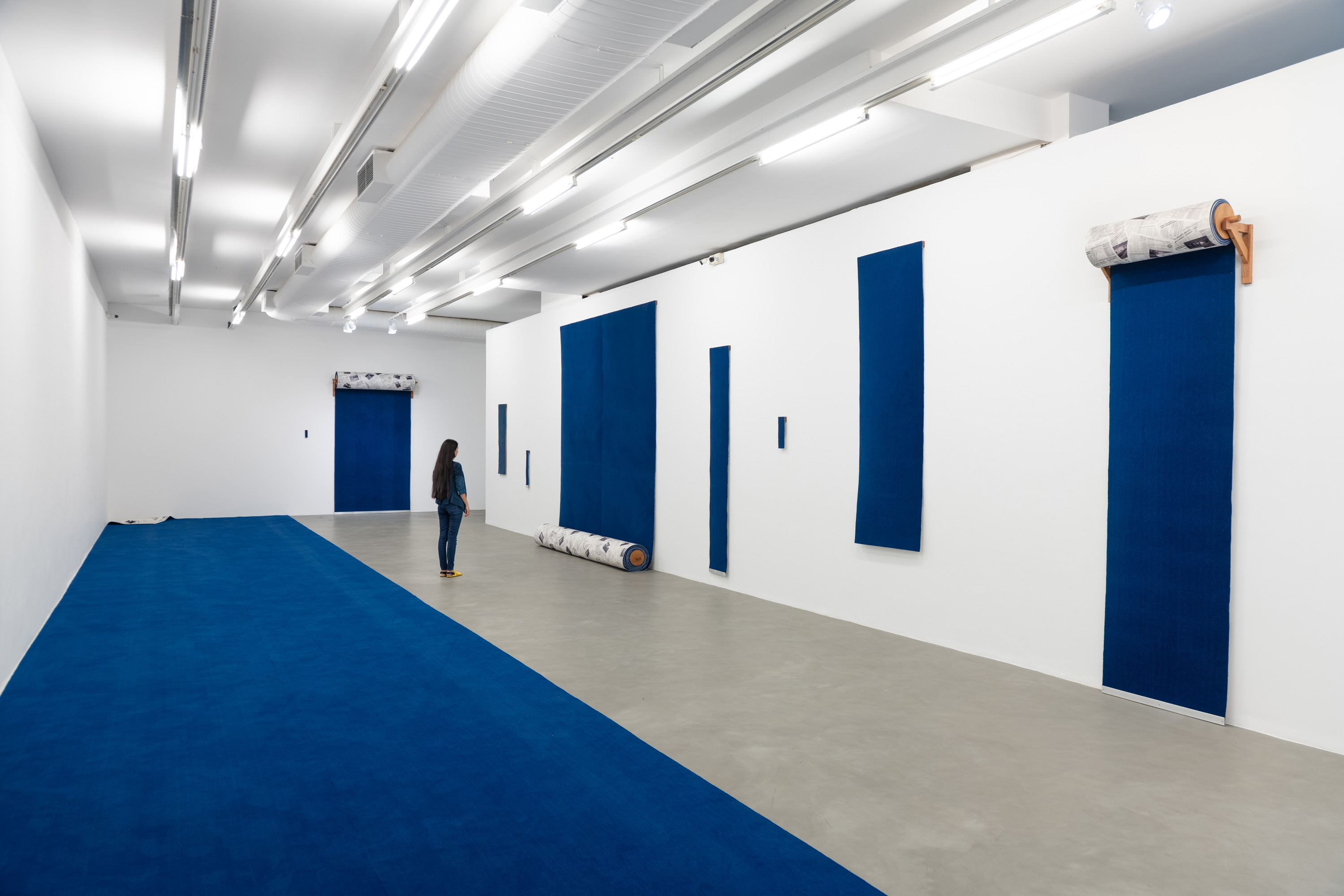 an art gallery with blue work