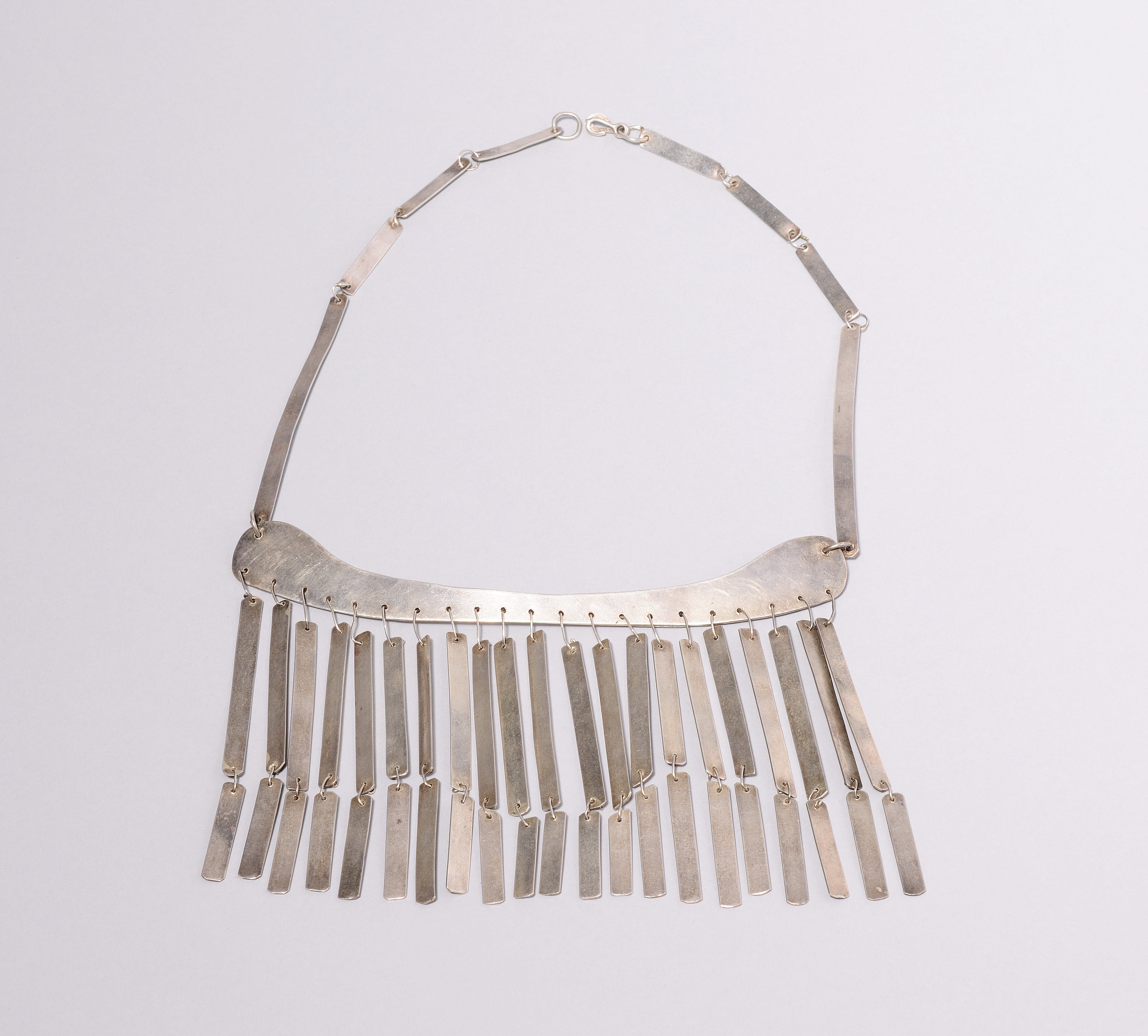 abstract necklace that looks like a purse