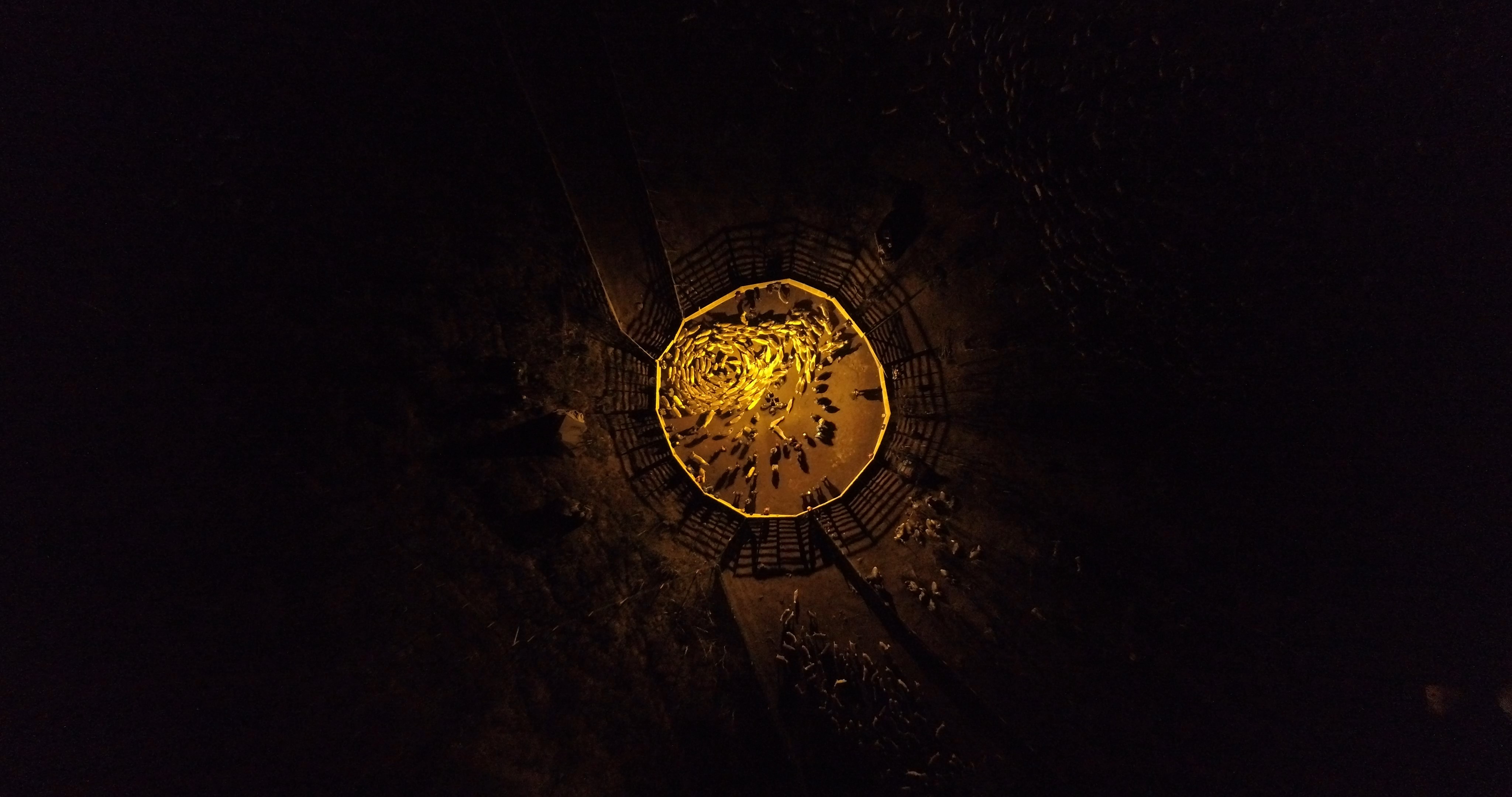 looking down a hole with grains of rice at the bottom