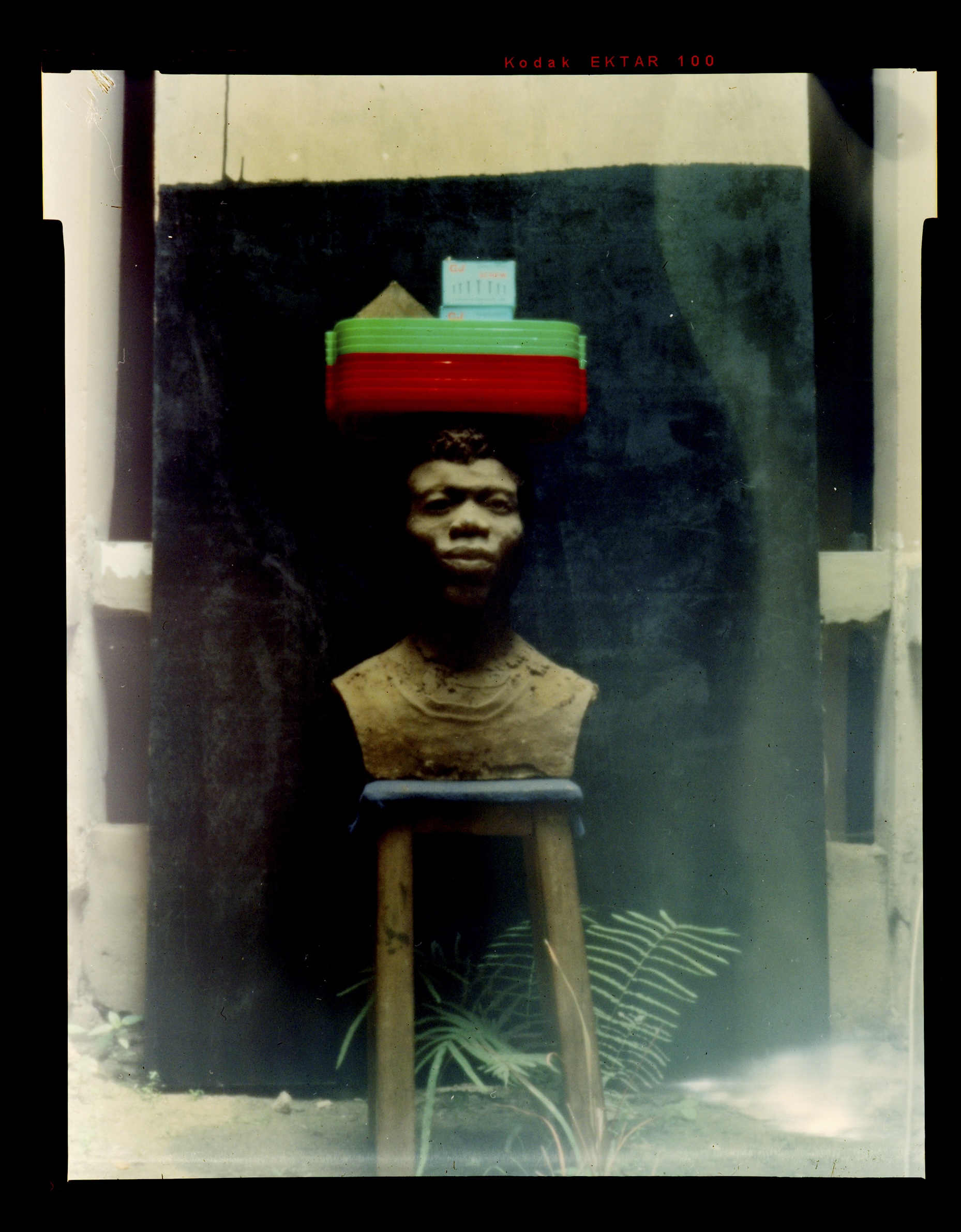 bust of a man with trays on his head