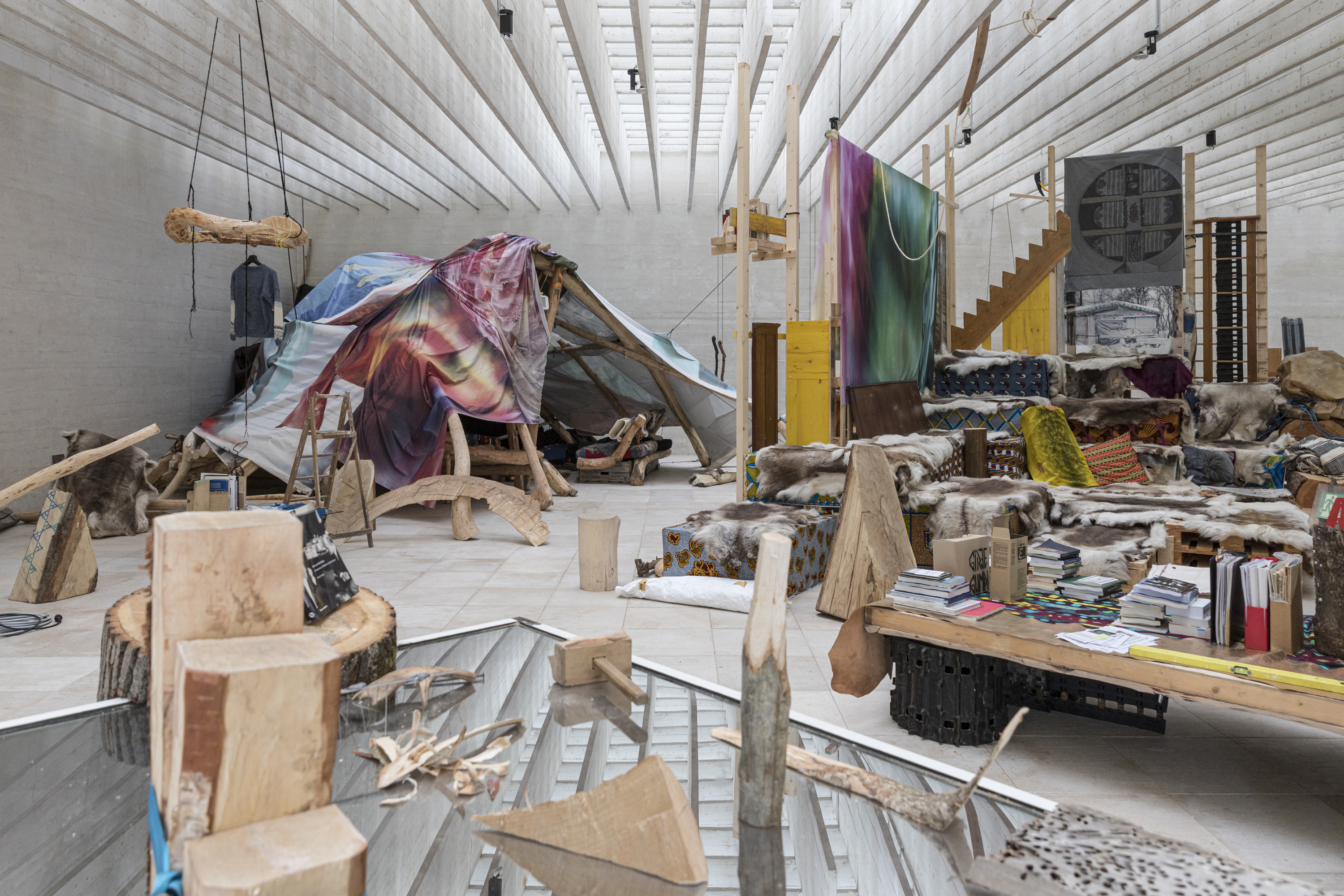 various art pieces made of wood and carpets