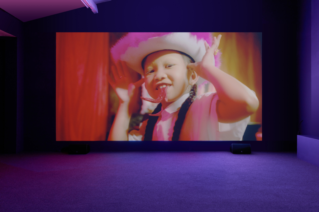 child with hands near ears