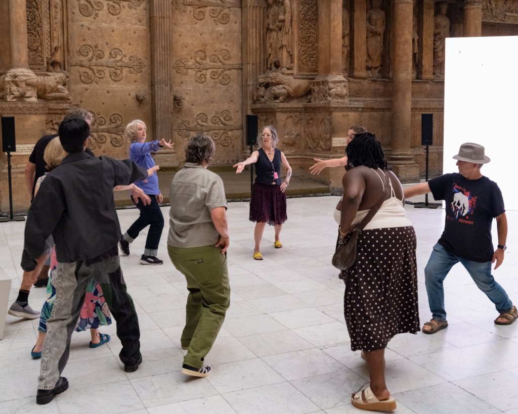 A photograph of people moving in a gallery